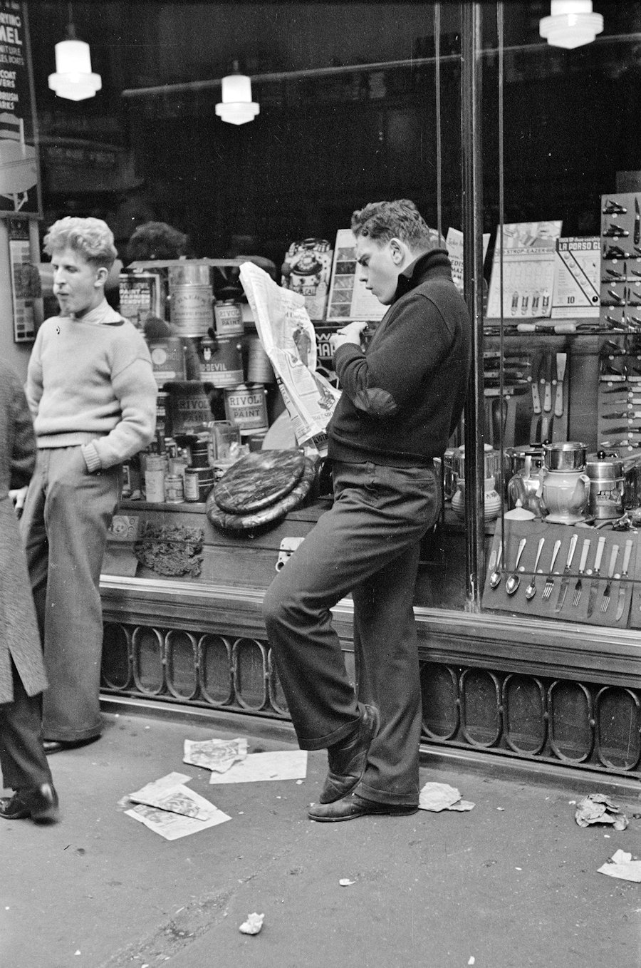 Teens hanging out in front of hardware store, NYC 1936.