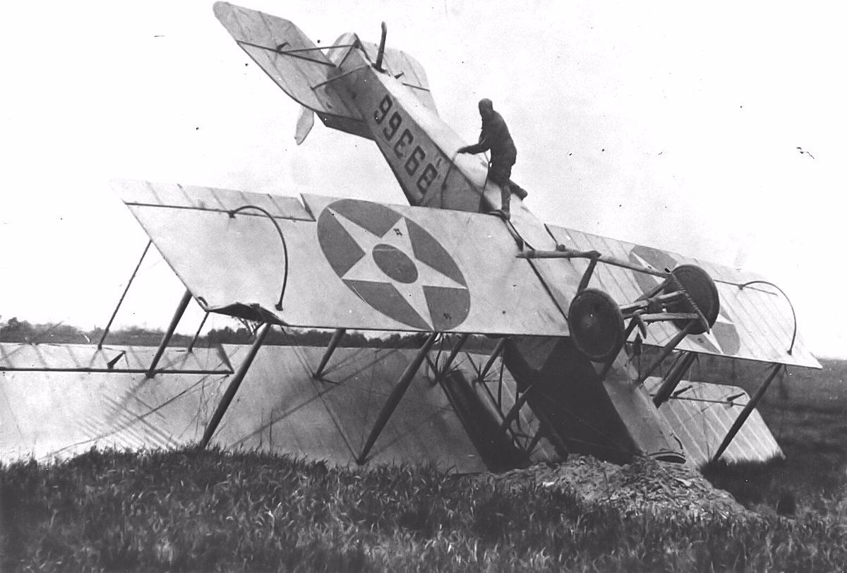 Pilot climbs up his wrecked Airmail plane