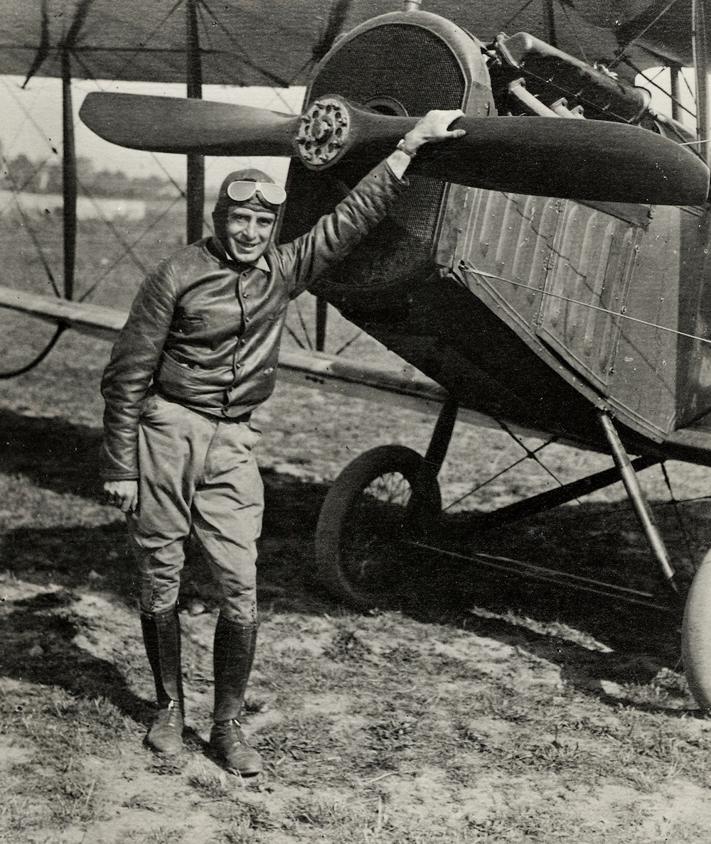 Airmail pilot Eddie Gardner posing with plane