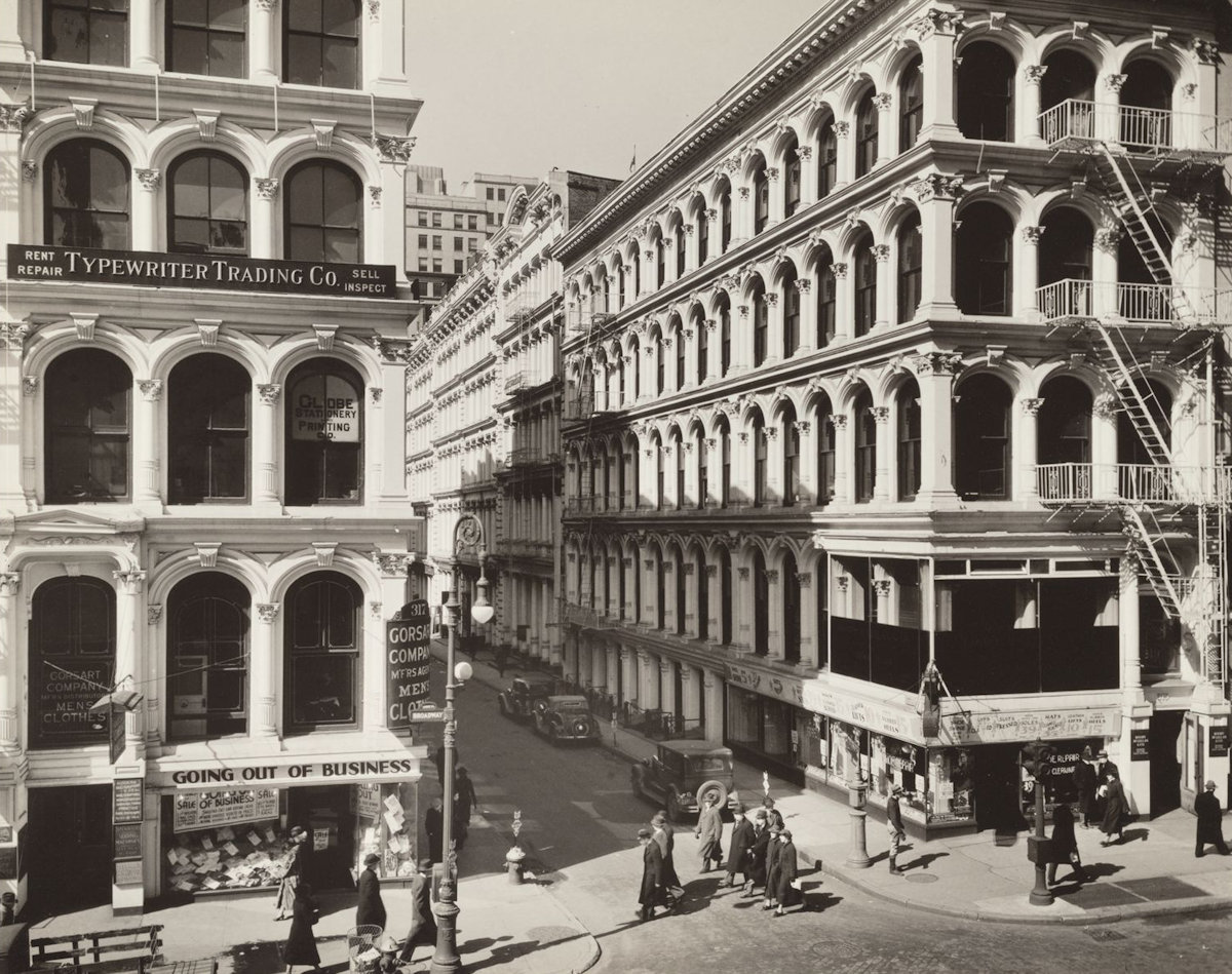 Pedestrians on a busy New York City street corner in 1936